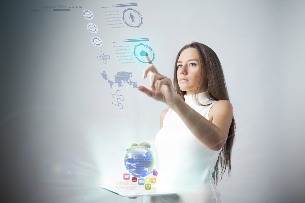 IStock, Young woman using new technologies by eternalcreative