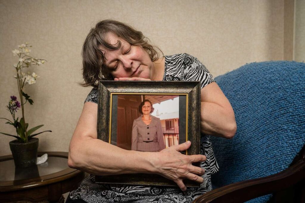 Summer’s grieving mother, Jeanine, clings to her picture. Jeanine wanted Summer’s story told in hopes of helping others. (Tomas Ovalle / Special to The Chronicle)